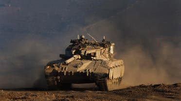 An Israeli tank maneuvers during a drill in the Golan Heights, near the border between the Israeli-controlled Golan Heights and Syria. (File photo: AP)