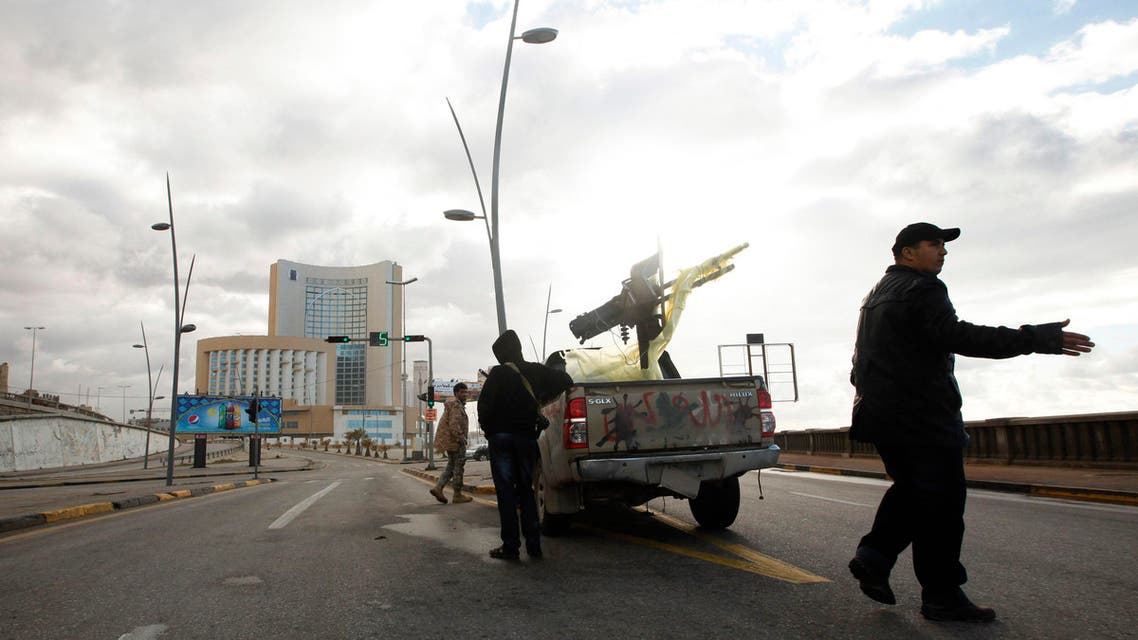 A vehicle belonging to security forces is pictured near Corinthia hotel (rear) in Tripoli January 27, 2015. (Reuters)