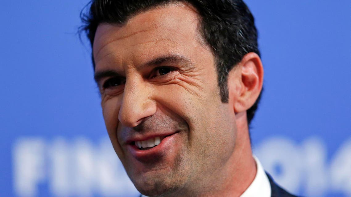 Champions League final ambassador Luis Figo smiles during the draw for the Champions League semi-finals matches at the UEFA headquarters in Nyon, in this April 11, 2014 file photo. (Reuters)