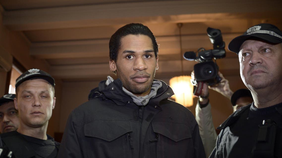 File photo taken on Jan. 20, 2015 shows Fritz-Joly Joachin (C), a French citizen of Haitian origin, arriving in court in the town of Haskovo, south eastern Bulgaria. (AFP)