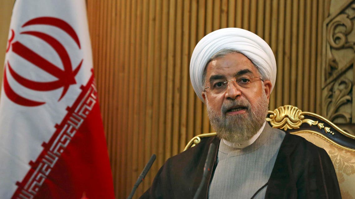 FLE - In this file photo taken Monday, Sept. 22, 2014, Iranian President Hassan Rouhani briefs media prior to departing Mehrabad airport to attend the United Nations General Assembly, in Tehran, Iran. AP