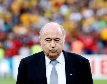 FIFA President Sepp Blatter reacts before the Asian Cup final soccer match between South Korea and Australia at the Stadium Australia in Sydney January 31, 2015. REUTERS