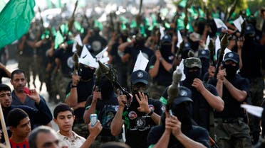 Masked Palestinian members of the Ezz Al-Din Al Qassam brigade, the military wing of Hamas, march with their weapons during a parade to mark the anniversary of a battle against Israel in Gaza City, Thursday, Nov. 14, 2013. (File photo: AP)