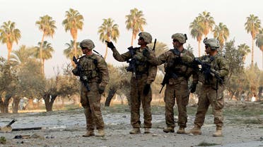U.S. troops keep watch at the site of a suicide attack on the outskirts of Jalalabad, January 5, 2015. (Reuters)