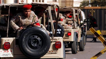 Soldiers in a convoy secure a military funeral ceremony of security personnel killed in attacks in Sinai, outside Almaza military airbase where the funerals were held, in Cairo, January 30, 2015. (File photo: Reuters)