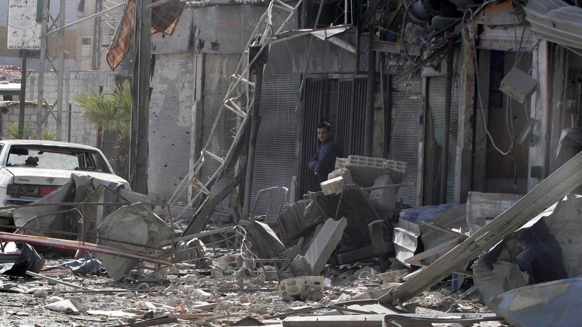 A man stands at a site hit by what activists said was an airstrike by forces loyal to Syria's President Bashar al-Assad in the Duma neighbourhood of Damascus January 28, 2015. (Reuters)