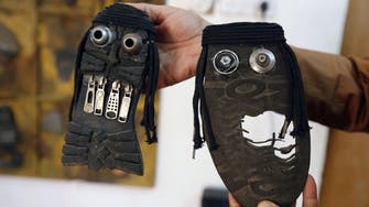 Iraqi artist gets creative with old shoes to mock ISIS 