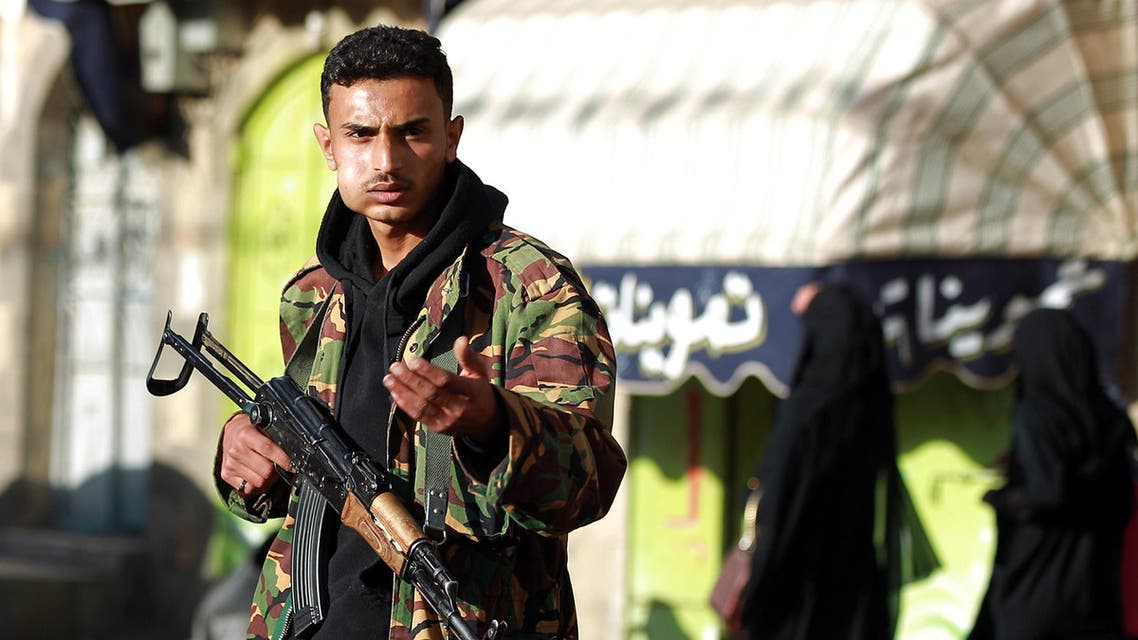 A Yemeni armed member of the Shiite Huthi movement in an army uniform guards a checkpoint on a street leading to the presidential palace in the capital Sanaa on Feb. 6, 2015. (AFP)