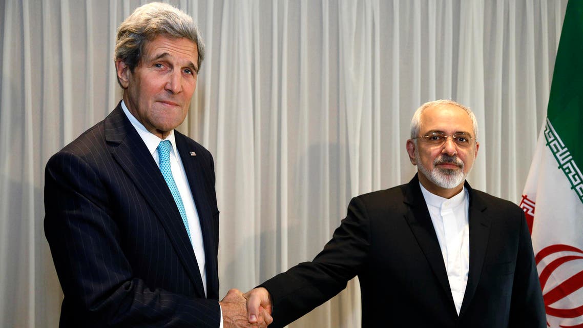 U.S. Secretary of State John Kerry shakes hands with Iranian Foreign Minister Mohammad Javad Zarif before a meeting in Geneva January 14, 2015. (Reuters)