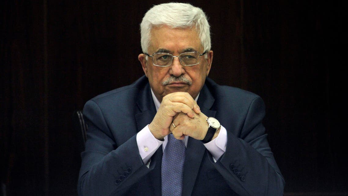 his July 28, 2013 file photo shows Palestinian President Mahmoud Abbas chair a session of the Palestinian cabinet in the West Bank city of Ramallah. After a decade in power, Abbas is no closer to a deal on Palestinian statehood, has failed to reclaim the Gaza Strip from political rival Hamas and is being disparaged by some as a pliant guardian of Israeli security needs in the West Bank. He dramatically changed course in January 2015 by signing up to the International Criminal Court, a move that could allow for war crimes complaints against Israel. (AP Photo/ Xinhua, Issam Rimawi, Pool)
