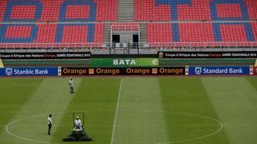 Stadium workers level the grass ahead of the African Cup of Nations final soccer match between Ivory Coast and Ghana on Sunday, at Estadio De Bata, Equatorial Guinea, Saturday Feb. 7, 2015. (AP)