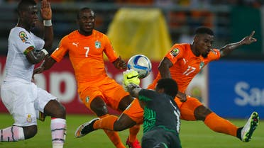 Ghana's goalkeeper Brimah Razak saves the ball against Ivory Coast's Serge Aurier (R) and Seydou Doumbia (C) during the African Nations Cup final soccer match in Bata, February 8, 2015.  (Reuters)