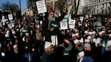 Muslim demonstrators hold placards during a protest against the publication of cartoons depicting the Prophet Mohammad in French satirical weekly Charlie Hebdo, near Downing Street in central London February 8, 2015. (Reuters)
