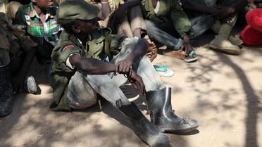Rebel child soldiers gather in Gumuruk, as they prepare to handover their weapons at a demobilisation ceremony in Jonglei State, eastern South Sudan, Jan. 27, 2015.  (Reuters)