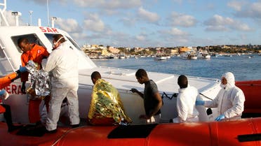 Migrants who survived a shipwreck arrive at the Lampedusa harbour February 11, 2015. An Italian tug boat rescued 9 people who had been on two different boats on Monday and brought them to the Italian island of Lampedusa on Wednesday morning. (Reuters)