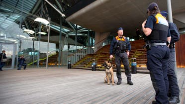 Police officers chat as they patrol outside the main courthouse in Antwerp, Belgium on Monday, Sept. 29, 2014. AP
