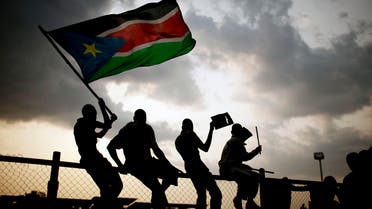 Southern Sudanese wave flags and cheer at the Republic of South Sudan's first national soccer match in the capital of Juba on Sunday, July 10, 2011.  (AP)