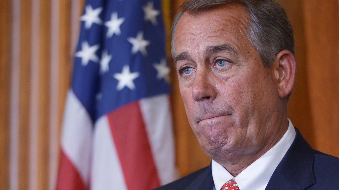 House Speaker John Boehner, R-OH, listens to a speaker during the signing ceremony for H.R.203, the "Clay Hunt Suicide Prevention for American Veterans Act." AFP