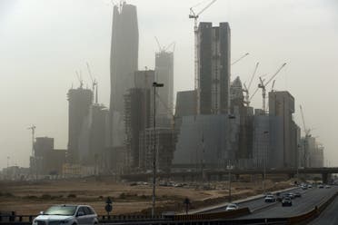  SAUDI ARABIA : Dust covers the Abdullah Finance Center in the Saudi capital Riyadh during a sandstorm on February 12, 2015. 