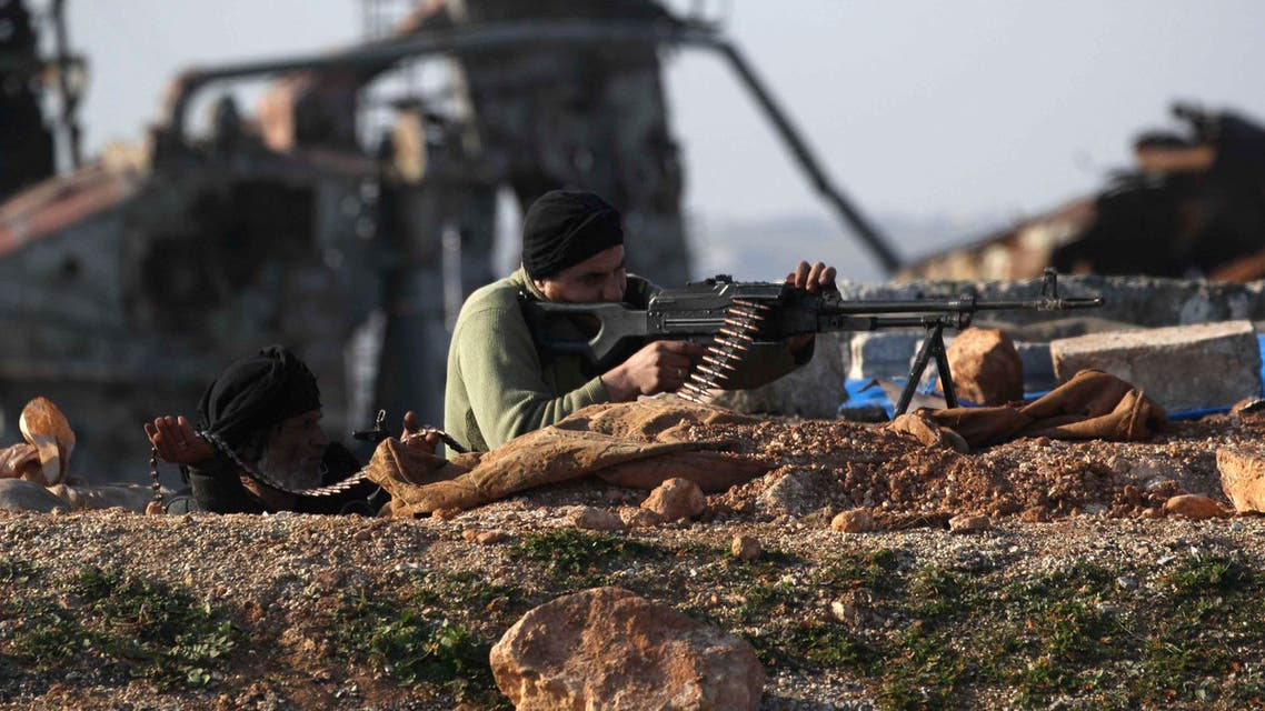 Abu Amara Brigade fighters take up positions with their weapon during clashes with forces loyal to Syria's President Bashar Al-Assad at the Bureij frontline of Aleppo January 24, 2015. Rebel fighters took control of Bureij hill, activists said. REUTERS