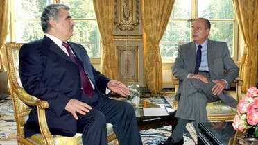 French President Jacques Chirac, right, and Lebanese Prime Minister Rafik Hariri chat during their meeting at the Elysee Palace in Paris Friday, July 18, 2003.  AP