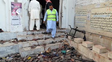 A rescue worker steps outside where victims' shoes are scattered after an explosion in a Shi'ite mosque in Shikarpur, located in Pakistan's Sindh province January 30, 2015. (File photo: Reuters)