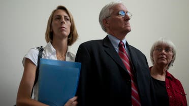 Cindy, right, and Craig Corrie, the parents of Rachel Corrie, a pro-Palestinian activist who was killed by an Israeli bulldozer in Gaza in 2003, stand together with their daughter Sarah after the district court's ruling in Haifa, Israel, Tuesday, Aug. 28, 2012. (File photo: AP)