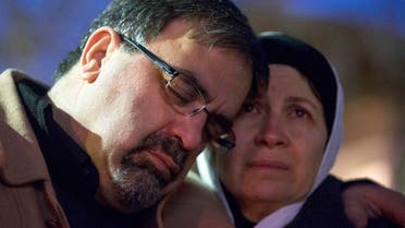 Namee Barakat embraces his wife Layla Barakat, parents of shooting victim Deah Shaddy Barakat, during a vigil in Chapel Hill Reuters