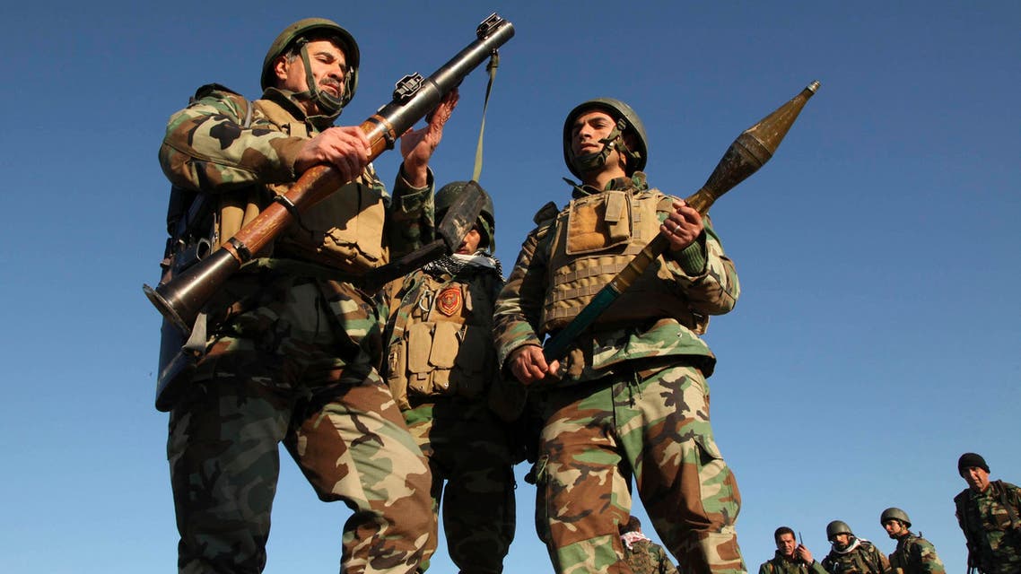 Kurdish Peshmerga fighters inspect an rocket-propelled grenade (RPG) launcher as they take control of the area, on the outskirts of Mosul February 6, 2015. (File photo: Reuters)