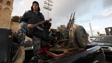 Members of the Libyan Police are seen on their vehicles as the Police prepare for deployment during the start of a security plan put forth by the Tripoli-based government to increase security in the Libyan capital, at Martyrs' Square in Tripoli Feb.9, 2015. (Reuters)
