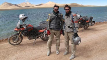 Colin Pyle (left) and Ryan Pyle (right) near a remote glacial lake in Tibet. BMW Motorrad Oakley Touratech.  (Still image from the television series: Tough Rides China with Ryan Pyle and Colin Pyle)