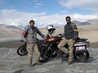 Ryan Pyle (left) and Colin Pyle (right) enjoy the views on the Karakoram Highway in Xinjiang. BMW Motorrad Oakley Touratech. (Still image from the television series: Tough Rides China with Ryan Pyle and Colin Pyle)