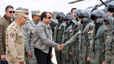 Egyptian President Abdel Fattah al-Sisi shakes hands with pilots and crews specialists of the Egyptian Air Force near the border between Egypt and Libya, in this February 18, 2015 handout courtesy of the Egyptian Defence Ministry. (Reuters)