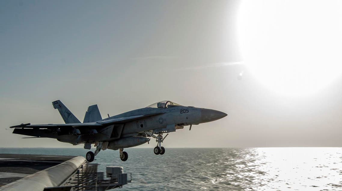 In this image released by the U.S. Navy on Friday, Dec. 5, 2014, a fighter jet launches from the flight deck of the Nimitz-class aircraft carrier USS Carl Vinson (CVN 70) as the ship conducts flight operations in the U.S. 5th Fleet area of operations supporting Operation Inherent Resolve targeting Islamic State militants in Iraq and Syria. (AP Photo