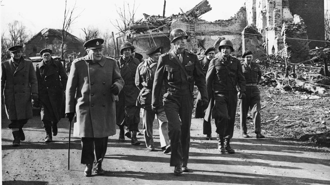 Prime Minister Winston Churchill of England with Gen. William Hood Simpson, Commander in Chief of the U.S. 9th Army, tour the ruins of Julich, Germany, on the Siegfried Line, March 7, 1945. (AP)