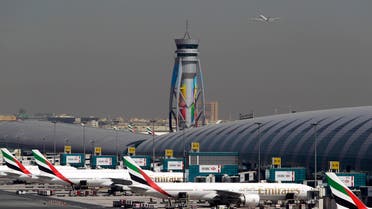 In this May 8, 2014 file photo, Emirates passenger planes are parked at their gates of Dubai airport in United Arab Emirates AP