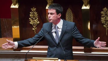 French Prime Minister Manuel Valls gestures as he speaks prior to a parliamentary vote of confidence over the government's economic reform at the French National Assembly, Paris, Thursday, Feb 19, 2015. AP