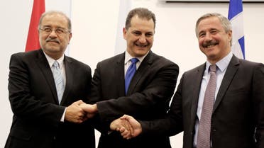 Cypriot Energy Minister Giorgos Lakkotrypis, center, shakes hands with his counterparts of Egypt Sherif Ismail, left, and Greece’ Yiannis Maniatis