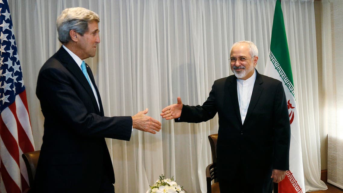 U.S. Secretary of State John Kerry, left, shakes hands with Iranian Foreign Minister Mohammad Javad Zarif before a meeting in Geneva, Switzerland Wednesday, Jan. 14, 2015. AP