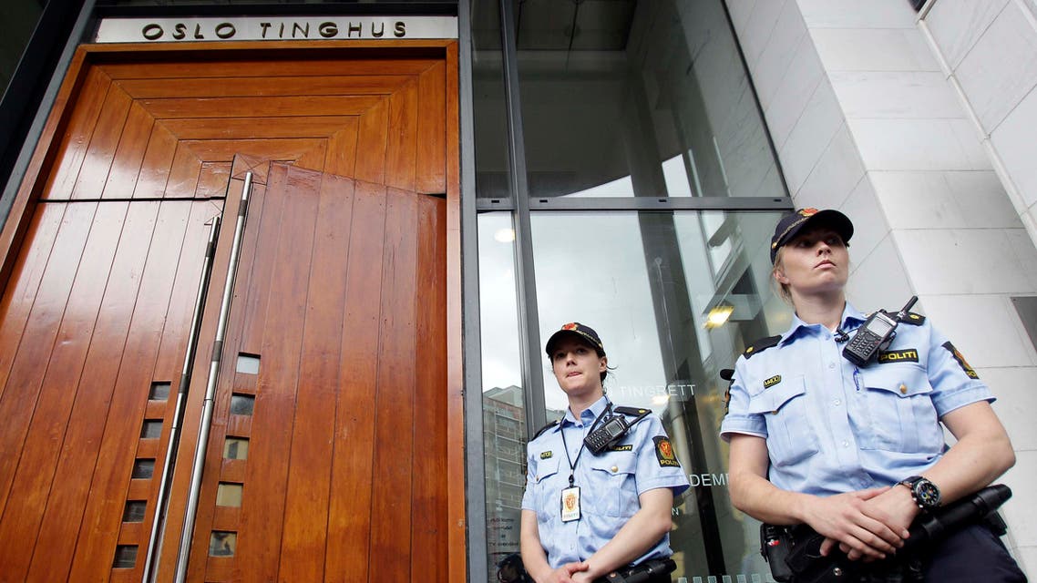 Police officers guard the court entrance in Oslo, Norway, Monday, July 25, 2011. AP