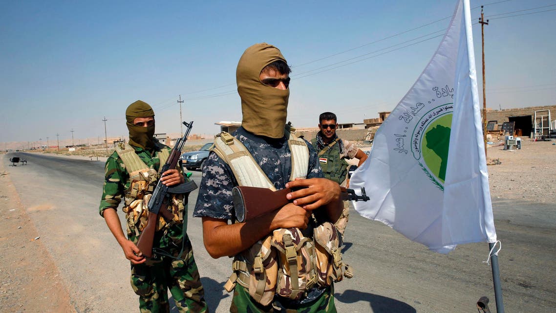 Fighters from the Shi'ite Badr Brigade militia guard a checkpoint outside the town of Sulaiman Pek. (File Photo: Reuters)