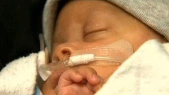 Baby born in amniotic sac hailed as ‘medical miracle’