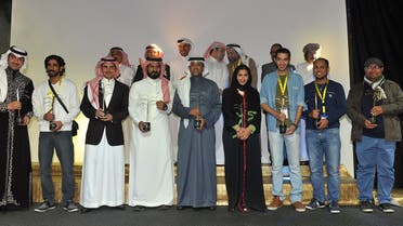  Saudi filmmakers and actors pose for a group picture with their awards on the last day of the Saudi Film Festival at Saudi culture center in the City of Dammam, some 400 km east of the capital Riyadh, on Feb. 24, 2015.  (AFP)