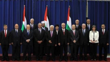 Palestinian President Mahmoud Abbas (C) with the members of the Palestinian unity government. (File photo: AFP)