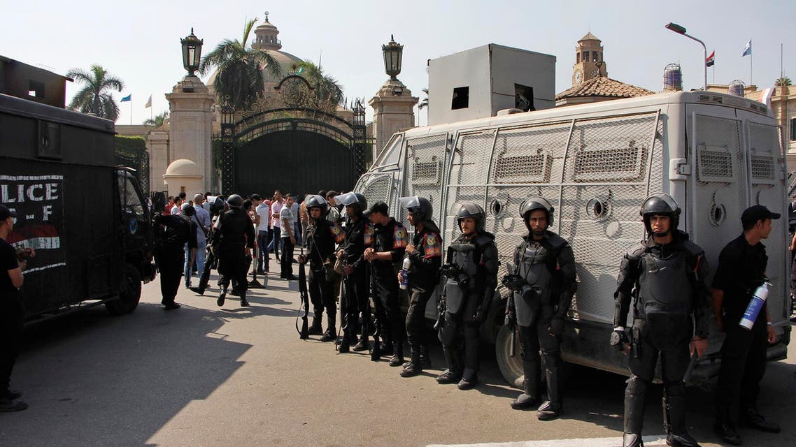 Egyptian security forces stand guard at Cairo University in Cairo, Egypt, Sunday, Oct. 12, 2014. (AP)
