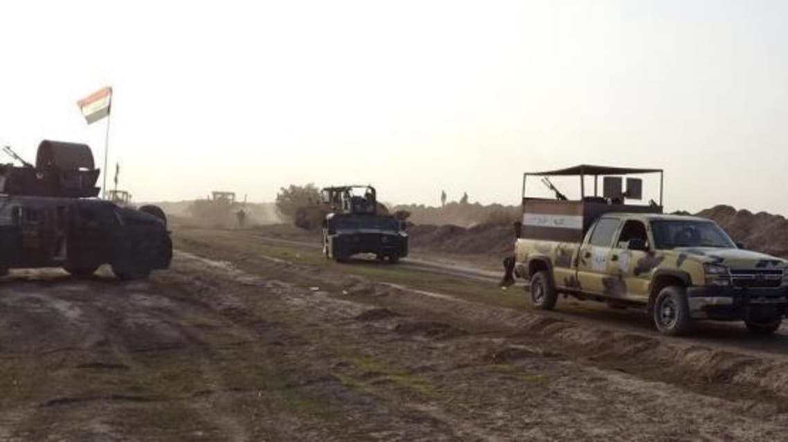 Iraqi security forces guard during the building of a new road between Diyala province and Samarra December 21, 2014. (Reuters)