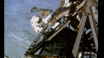 U.S. astronauts begin spacewalk at orbiting lab 