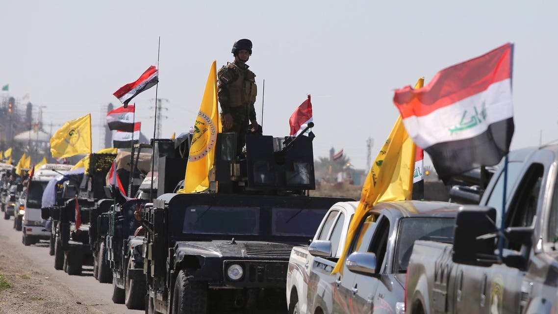 Members of the Iraqi security forces heading from the city of Samarra north of Baghdad drive towards al-Dawr area south of Tikrit to launch an assault against the Islamic State group (IS) on February 28, 2015. AFP