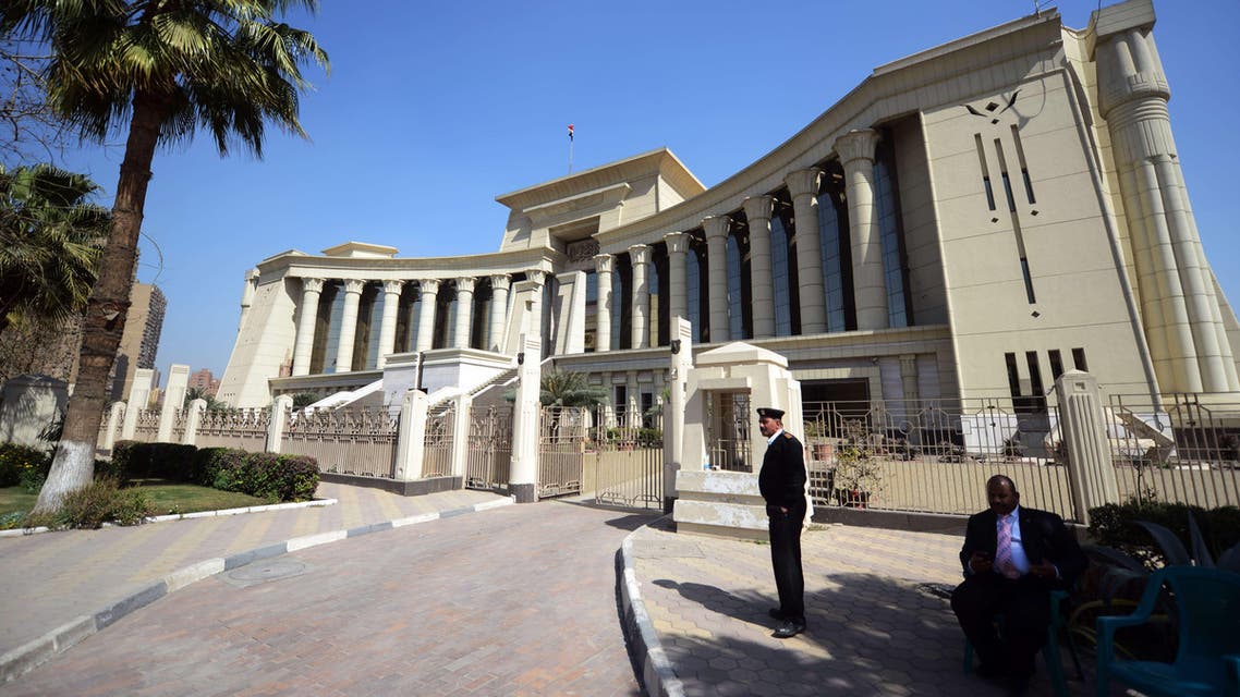 A member of the Egyptian security forces stands guard outside the constitutional court during a session to rule on the law organizing the upcoming parliamentary elections on March 1, 2015 in the capital Cairo. (AFP)