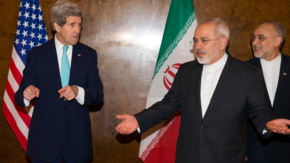 U.S. Secretary of State John Kerry and Iran's Foreign Minister Mohammad Jawad Zarif (C) gesture as they arrive to resume nuclear negotiations in Montreux March 2, 2015. (Reuters)